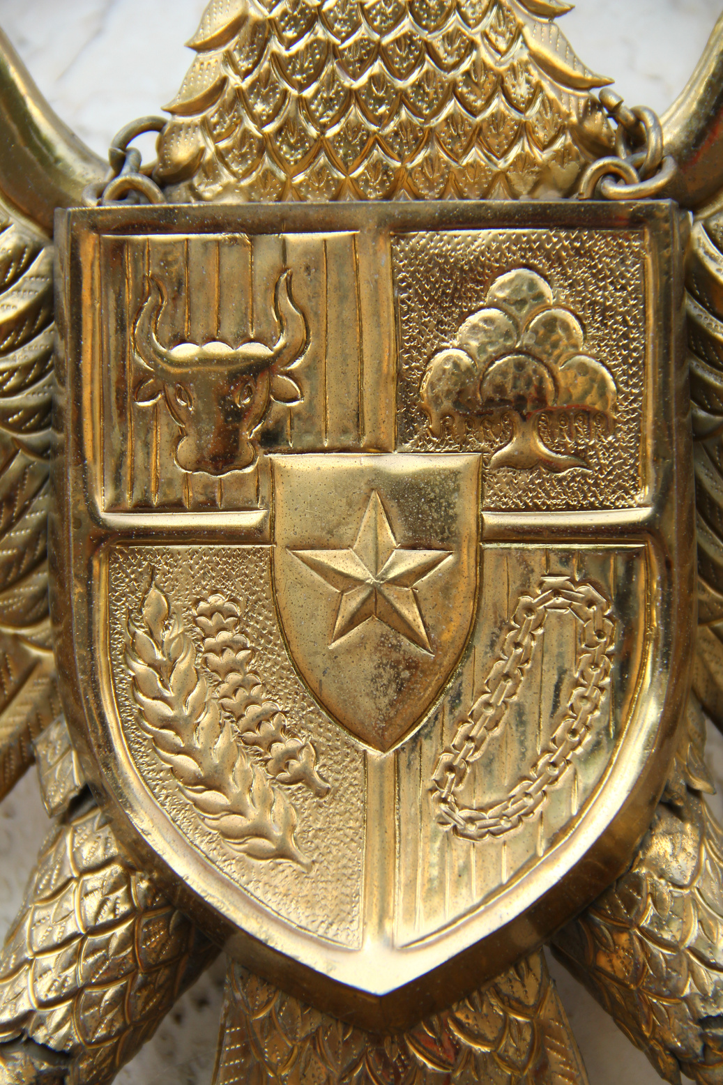 This is a brass metal in the form of the Pancasila symbol.
